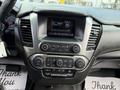 Interior dashboard of a 2017 Chevrolet Tahoe featuring a touchscreen display with various control buttons and climate settings
