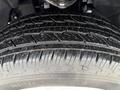 A close-up view of a tire on a 2024 Chevrolet Silverado 1500 showcasing its detailed tread pattern and sidewall markings
