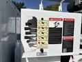 Control panel of a 2019 Freightliner M2 106 featuring labeled switches and indicators for operation and safety warnings