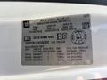 A white label with vehicle specifications for a 2017 Chevrolet Colorado including manufacturing details and tire pressure information
