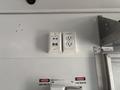 A 2020 Freightliner MT45 interior featuring electrical outlets including two standard outlets and a network port with labels indicating voltage warnings