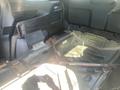 The interior of a 2020 Ford Explorer showcasing parts of the rear cargo area and structural framework without upholstery or trim