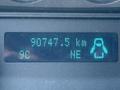 Image of a digital display showing 90747.5 km and 9°C with a penguin icon and NE direction indicator