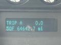 A digital display showing trip information for a 2012 Ford F-550 with the trip set to 0.0 miles and total mileage at 64642.7 miles