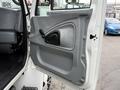 The interior door panel of a 2006 International 4200 truck featuring a gray design with a door handle and control for window operation