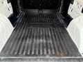 A rubberized cargo floor mat in the rear of a 2017 RAM ProMaster City with ribbed texture and the brand name embossed in the center