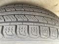 Close-up of a 2008 Wells Industries Inc EW1422 tire showcasing its tread pattern and rubber surface