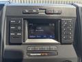 The image shows the dashboard of a 2019 Ford F-150 featuring a digital display with radio settings and buttons for various controls