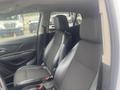 Interior view of a 2018 Buick Encore featuring two black leather seats and a modern dashboard design