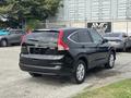 2014 Honda CR-V in black color parked with a rear view showcasing its design and features