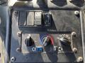 Control panel of a 2011 Autocar Xpeditor featuring various knobs and switches for regulating temperature and electrical functions