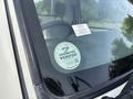 A 2010 Daihatsu Hijet is visible with an odometer verification sticker on the windshield