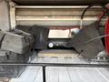 A 2017 Chevrolet Colorado with an open truck bed displaying various mechanical components and equipment including a battery and a pressure gauge