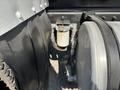 Close-up of a 2008 Peterbilt 340 truck showing a fuel filter and metal components connected to the chassis