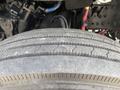 Close-up of a tire tread from a 2010 Freightliner M2 106 showing detailed grooves and surface texture