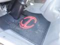 Close-up of a rubber mat featuring a red logo inside the cab of a 2015 Hino 195 truck with a gear shift visible above the mat