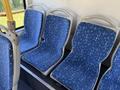Interior view of blue patterned seats in a 2016 Grande West Vicinity bus with empty seats visible in a row
