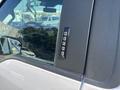 Close-up of the door handle area of a 2019 Ford F-150 featuring a keypad for keyless entry