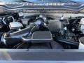 Close-up of the engine compartment of a 2020 Ford F-350 showing various components including the air intake system and engine block
