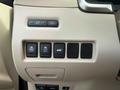 A 2016 Nissan Murano interior control panel featuring various buttons for vehicle functions including trip reset and parking features