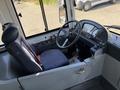 Interior view of a 2016 Grande West Vicinity bus showing the driver's seat steering wheel and control dashboard