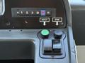 The dashboard controls of a 2016 Grande West Vicinity featuring gear selection buttons and switches labeled Deploy and Stow along with a green button