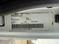 A 2013 International Durastar 4300 vehicle identification label with details including VIN date and model information