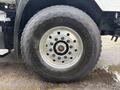 Close-up of a 2013 Freightliner 114SD tire with visible tread and the Goodyear logo on the sidewall