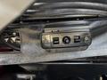 A panel with two power outlets and a switch located on the interior side of a 2020 Chevrolet Express vehicle