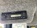 A Delphi radio display mounted on a gray felt surface showing the time as 2:17 PM with various control buttons and knobs