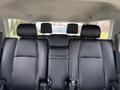 Interior view of a 2021 Toyota 4Runner showing black fabric seats with headrests and seat belts