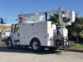 A 2005 Freightliner M2 106 bucket truck with a white body and a rear-mounted elevating work platform