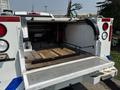 A 2017 Chevrolet Colorado truck with an open cargo bed showing wooden planks and metal supports inside