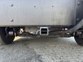 Close-up of the underside of a 2008 Workhorse W62 showing the hitch receiver and exhaust components