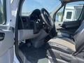 2016 Mercedes-Benz Sprinter interior view showing the driver’s seat steering wheel and dashboard