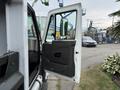 The image shows the open door of a 2012 International TerraStar truck showcasing the interior features and design of the driver's side cabin
