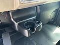 Black plastic console in a 2008 Peterbilt 340 featuring two cup holders and a textured surface