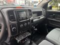 Interior dashboard of a 2016 RAM 1500 featuring a touchscreen display climate controls and gear shift area with metallic accents