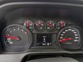 Dashboard of a 2024 Chevrolet Silverado 1500 displaying gauges for speed fuel level and engine RPM with a digital screen showing a speed of 0 kmh