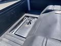 Interior view of a 1962 Ford 2WHDR showing a black truck bed with a metal battery compartment and wiring in the center
