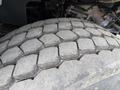 Close-up of a worn tire tread from a 2016 International 7600 showing hexagonal patterns and grooves designed for traction and stability
