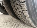 Close-up of a worn tire on a 2013 International Workstar 7500 with visible tread patterns and grooves