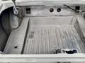 A 1968 Ford Mustang Two Door Convertible with an empty trunk space showing a flat floor and side panels