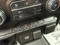 The dashboard controls of a 2019 Chevrolet Silverado 1500 featuring climate control buttons and USB ports
