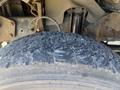 Close-up of a worn tire on a 2009 Workhorse W62 showing deep tread cracks and uneven wear patterns