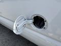 A close-up of the fuel cap of a 2008 Ford Econoline showing the cap and the opening where fuel is inserted