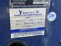 A blue inspection sticker on a 2015 Hino 358 truck displaying information about the vehicle and inspection details
