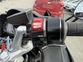Close-up of the control handle of a 2016 Yamaha FJR1300AE motorcycle featuring buttons for stop start and run along with a mode switch