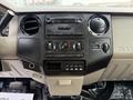 Dashboard of a 2008 Ford F-450 SD featuring a radio control panel climate control knobs and various buttons for vehicle functions