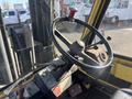 Interior view of a 1993 Hyster H80XL forklift showing the steering wheel controls and dashboard details